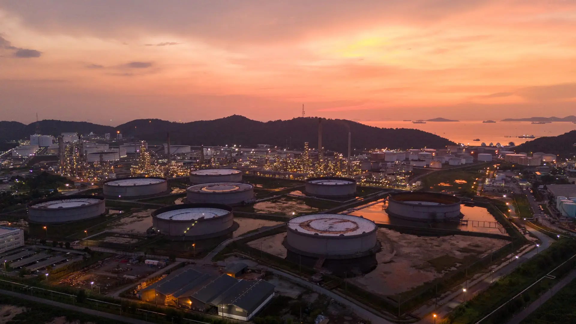 Oil Refinery plant at sunset. Gas Chemical Equipment Prodiction import export Concept, Crude Oil Refinery Plant Steel Pump Pipe line and Chimney and Cooling tower, Chemical Petrochemical